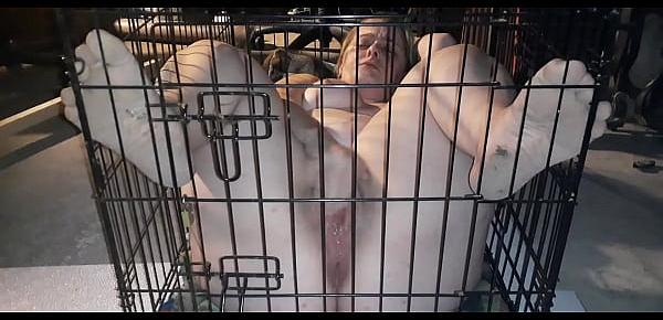  My sex slave plays with herself while locked inside cage